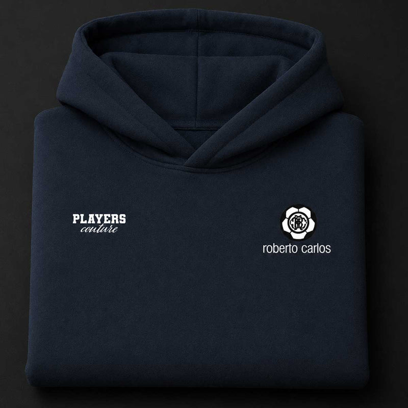 Navy blue hoodie with 'Players Couture' and 'Roberto Carlos' logos on a black background