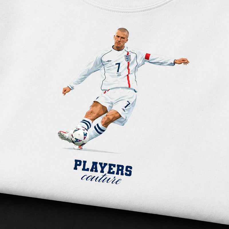 Soccer player in a white uniform with a soccer ball, wearing a 'Players Couture' shirt.