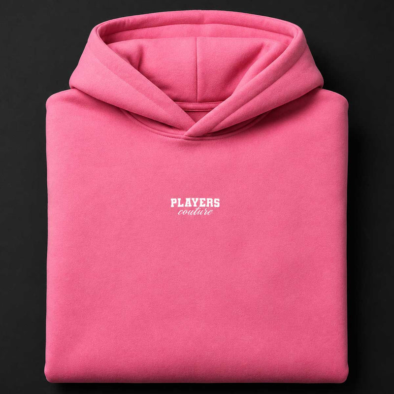 Pink hoodie with 'PLAYERS couture' logo on a black background