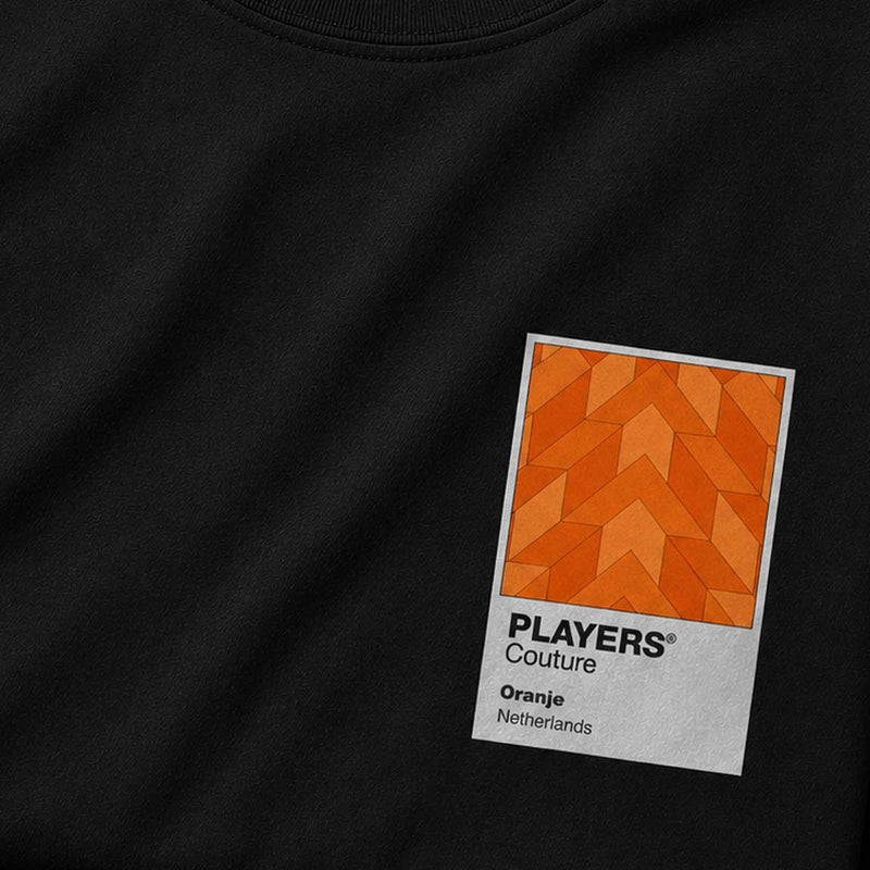 Black t-shirt with a geometric patterned label on the chest