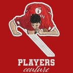 Robbie Fowler Celebration Badge Men's Hoodie – red close-up detail shot of the Robbie Fowler Players Couture logo design