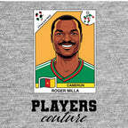 Roger Milla World Cup Sticker Men's T-Shirt – grey close-up detail shot of the Roger Milla World Cup Players Couture logo