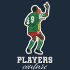 Roger Milla Badge Men's Hoodie – navy close-up detail shot of the Roger Milla Players Couture logo design