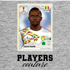 Sadio Mane World Cup Sticker Men's T-Shirt – grey close-up detail shot of the Sadio Mane World Cup Players Couture logo