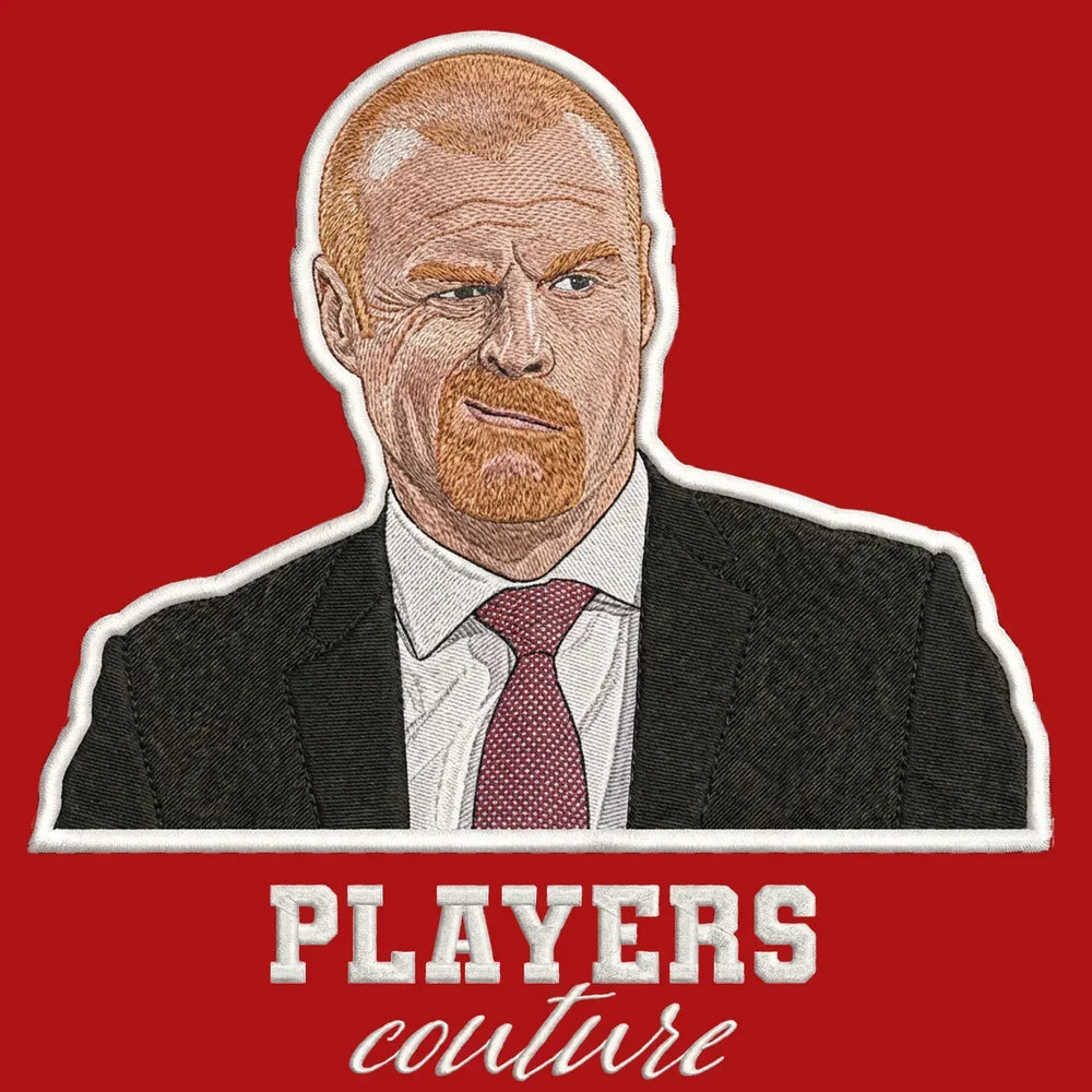 Sean Dyche Badge Men's Hoodie – red close-up detail shot of the Sean Dyche Players Couture logo design