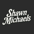 Shawn Michaels Logo Men's Hoodie – black close-up detail shot of the Shawn Michaels Players Couture logo design