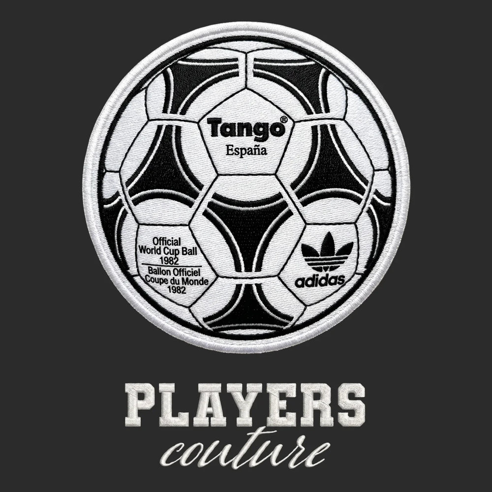 World Cup Tango Ball Badge Men's Hoodie – white close-up detail shot of the World Cup Tango Ball Players Couture logo design