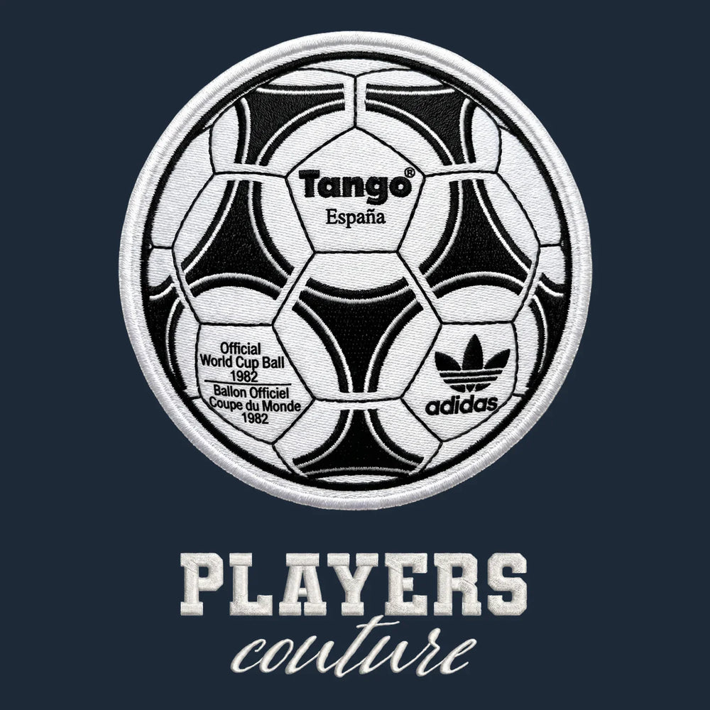 World Cup Tango Ball Badge Men's Hoodie – white close-up detail shot of the World Cup Tango Ball Players Couture logo design