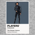 The Hunger Games Katniss Everdeen with bow and Mockingjay symbolism between District 12 and the Capitol arena Icon Frame artwork in grey