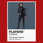 The Hunger Games Katniss Everdeen with bow and Mockingjay symbolism between District 12 and the Capitol arena Icon Frame artwork in red