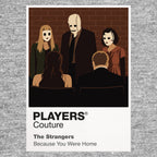 The Strangers – Masked Trio Dollface, Pin-Up Girl and the Man in the Mask arranged as an unnervingly calm masked portrait Icon Frame artwork in grey