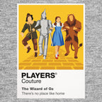 The Wizard of Oz Dorothy, Scarecrow, Tin Man and Cowardly Lion following the Yellow Brick Road towards Emerald City Icon Frame artwork in grey
