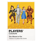 The Wizard of Oz Dorothy, Scarecrow, Tin Man and Cowardly Lion following the Yellow Brick Road towards Emerald City Icon Frame artwork on white