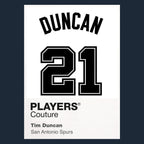 Tim Duncan 21 White Jersey Frame Men's T-Shirt – navy close-up detail shot of the Tim Duncan 21 White Players Couture logo
