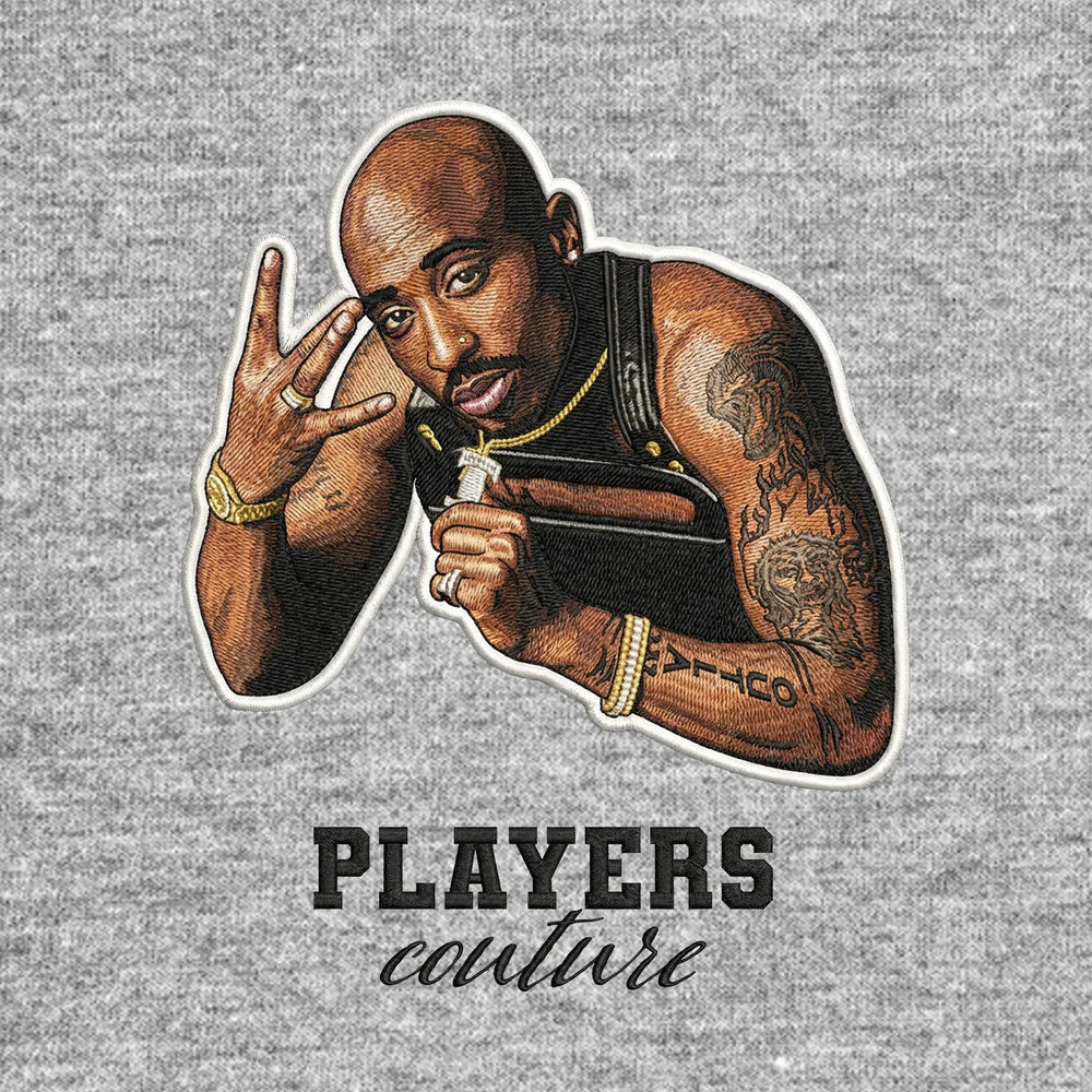 Tupac Shakur Badge Men's T-Shirt – black close-up detail shot of the Tupac Shakur Players Couture logo design