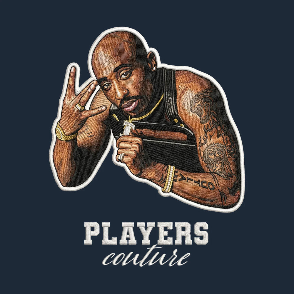 Tupac Shakur Badge Men's Hoodie – white close-up detail shot of the Tupac Shakur Players Couture logo design
