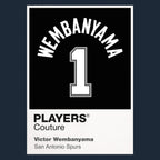 Victor Wembanyama 1 Jersey Frame Men's T-Shirt – navy close-up detail shot of the Victor Wembanyama 1 Players Couture logo