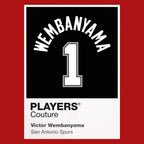 Victor Wembanyama 1 Jersey Frame Men's T-Shirt – red close-up detail shot of the Victor Wembanyama 1 Players Couture logo