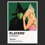 Wicked Elphaba and Glinda in contrasting green, pink and black silhouettes above the land of Oz Icon Frame artwork in black