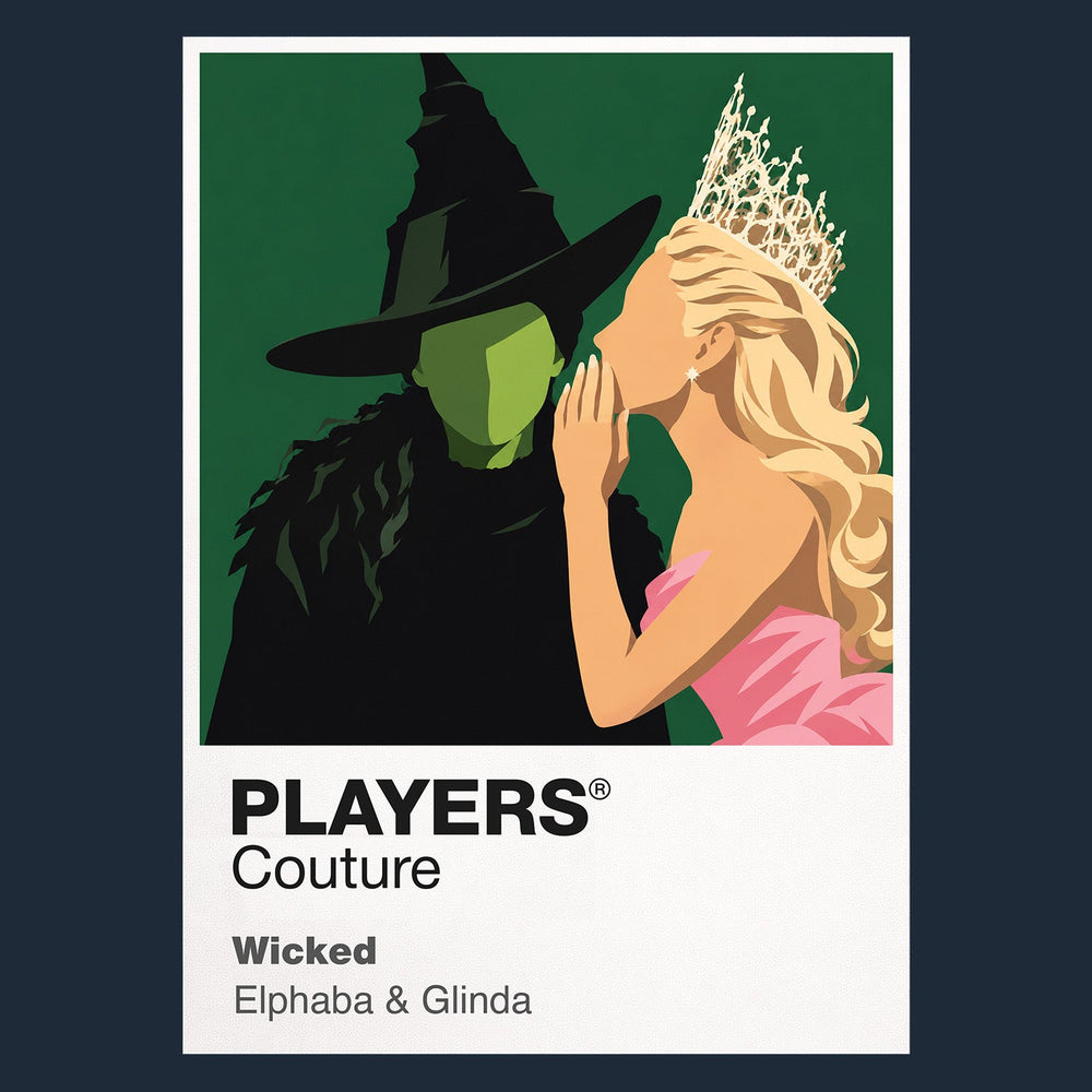 Wicked Elphaba and Glinda in contrasting green, pink and black silhouettes above the land of Oz Icon Frame artwork in navy