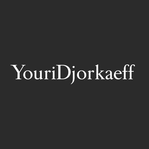 Youri Djorkaeff Logo Men's Hoodie – black close-up detail shot of the Youri Djorkaeff Players Couture logo design