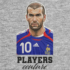 Zinedine Zidane Badge Men's Hoodie – grey close-up detail shot of the Zinedine Zidane Players Couture logo design
